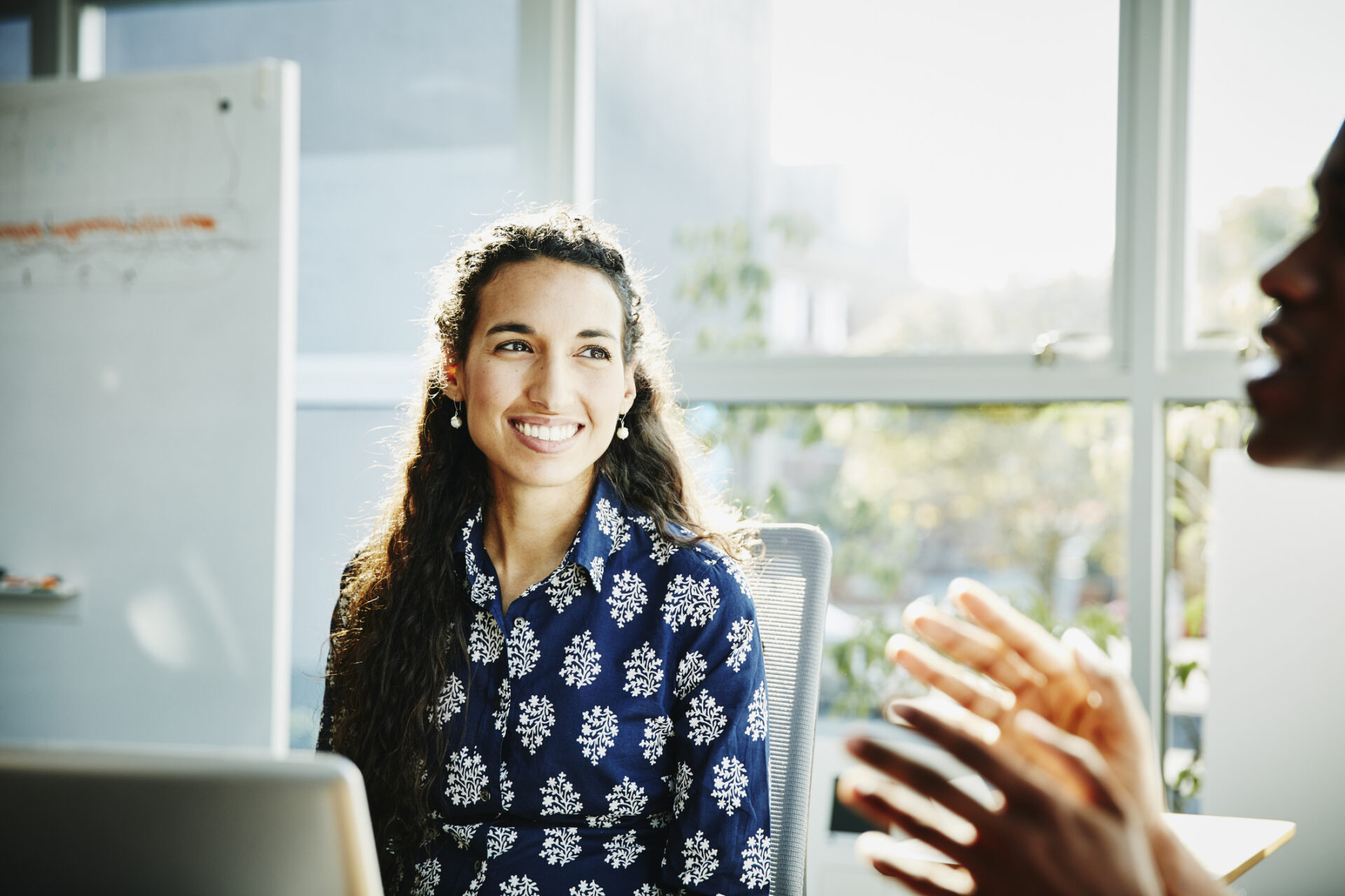 Smiling businesswoman learning how to pay off student loans